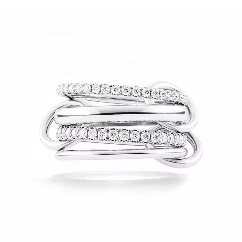 Milla ring in rhodium plated sterling silver with interwoven bands and pavé cubic zirconia, modern stacked ring design.
