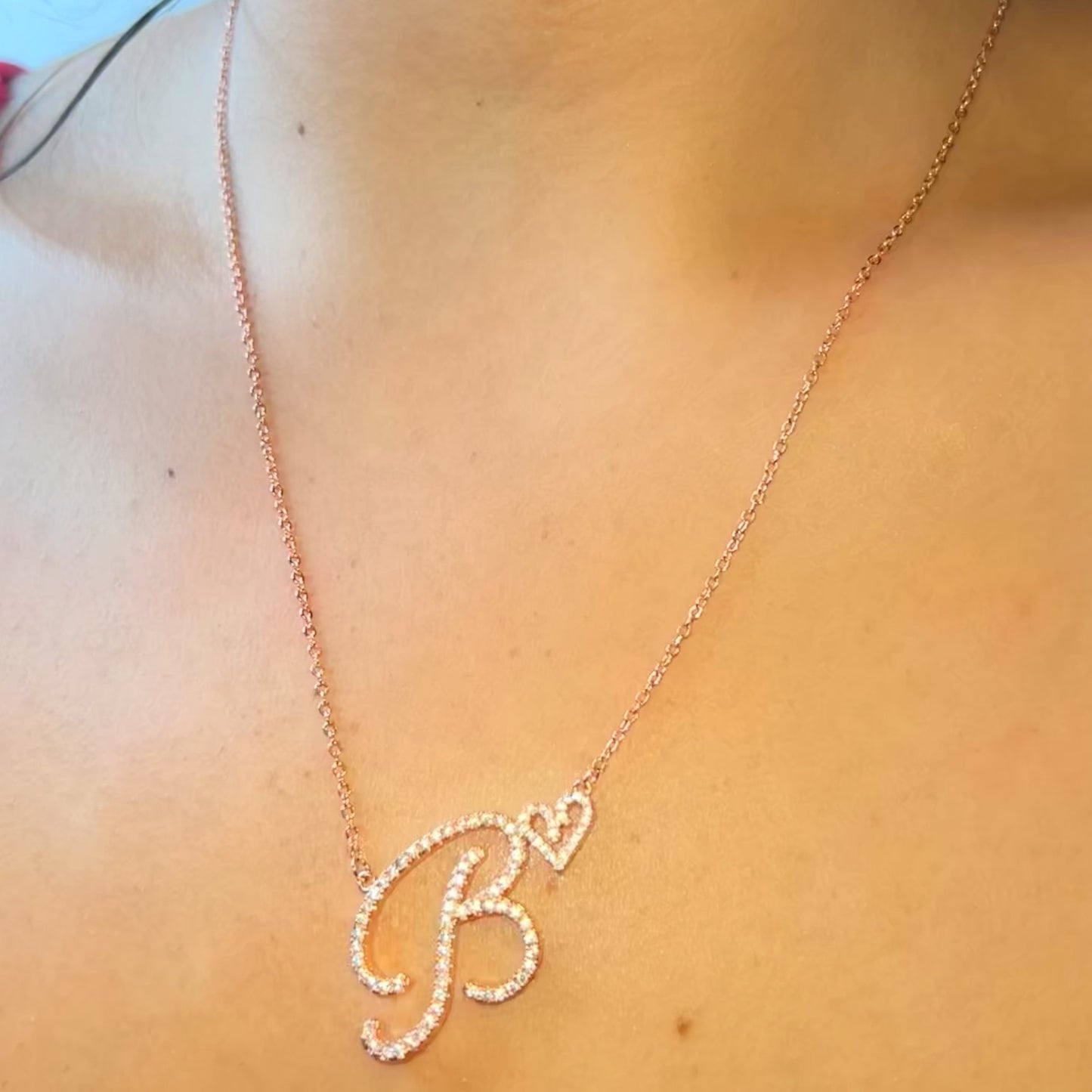 Custom Cubic zirconia set in a letter pendant design