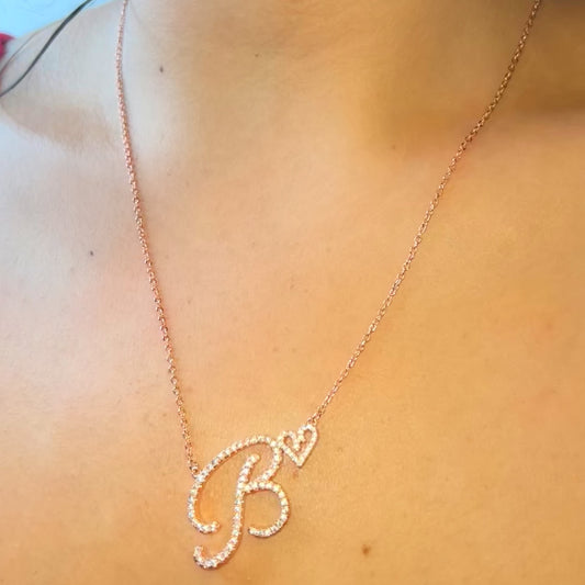 Custom Cubic zirconia set in a letter pendant design