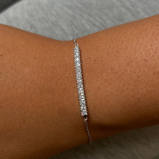 Princess cut cubic zirconia set in a dainty design.
