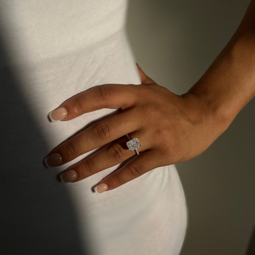 Kira ring sparkling in natural light on finger