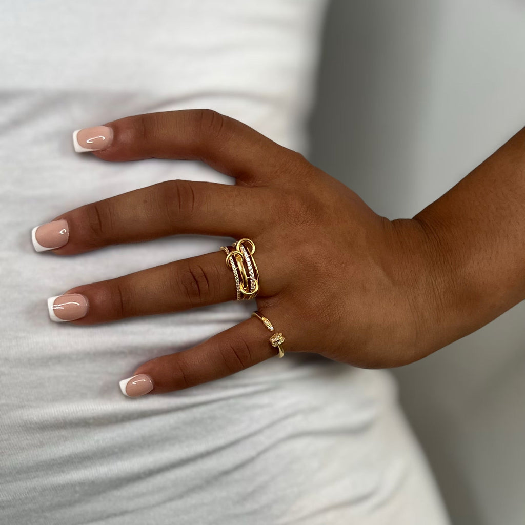 Milla ring and Zaria ring styled on separate fingers, 18K gold plated sterling silver with cubic zirconia, modern mixed ring stack look.