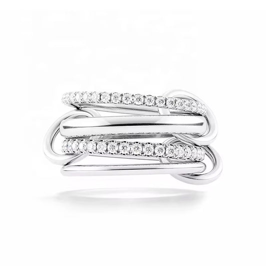 Milla ring in rhodium plated sterling silver with interwoven bands and pavé cubic zirconia, modern stacked ring design.