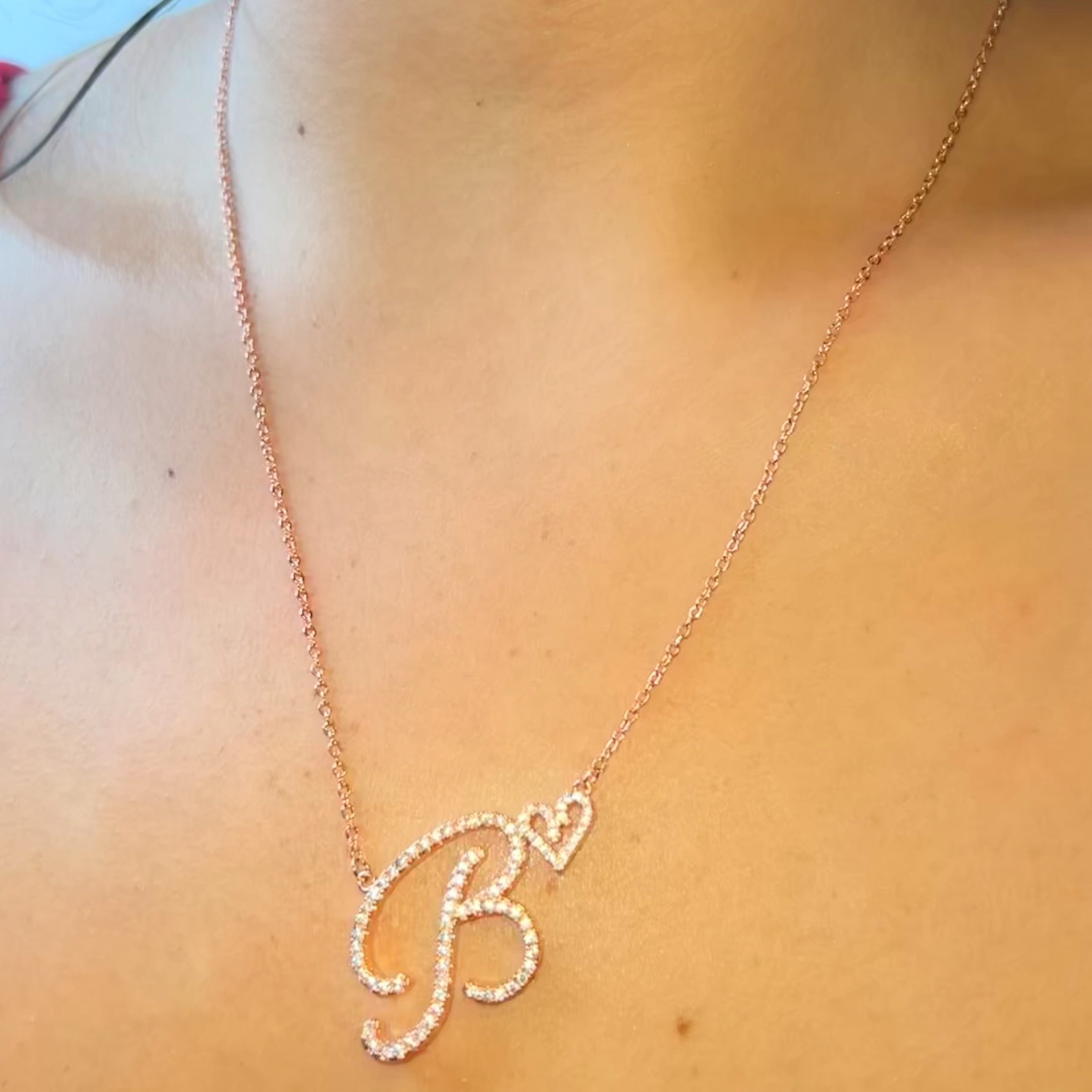 Custom Cubic zirconia set in a letter pendant design 